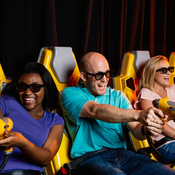 What is the Andretti 7D Xperience, you ask? It's the ride that everyone leaves talking about. The ride that engages your senses, immerses you in a world of action, and delivers an amazing 7D adventure that is unlike any other.
Andretti 7D Experience is a 3D interactive attraction with amazing special effects! Multiple riders at a time compete for the highest score using laser blasters and battling on-screen enemies. You actually feel the earth-rumbling movement and wind, hear the sounds all around you, and sometimes even jump with fright (or joy!).
The Andretti 7D Dark Ride experience is approximately 5 minutes in length. Riders must be at least 40″ tall.