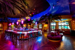 The Mojito bar is located on the second floor, surrounded by plenty of seating and couches.