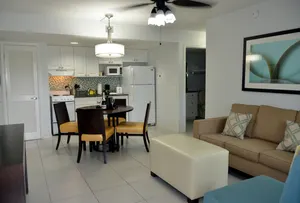 Living Room & Kitchenette with a full-size fridge and stove. Separate bedroom & bathroom.