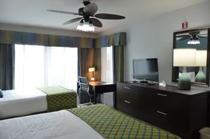 Living Room & Kitchenette with a full-size fridge and stove. Separate bedroom & bathroom.