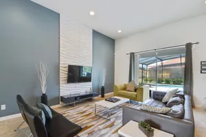 This home in ChampionsGate Resort boasts a modern open plan family room.