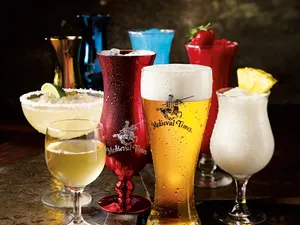 assortment of beverages served in souvenir glasses