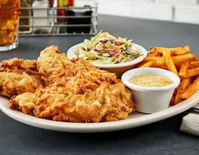 Fried Chicken Tender Plate - Buttermilk marinated chicken tenders, seasoned, hand-breaded and fried golden brown. Served with coleslaw, seasoned fries and Creole mustard.