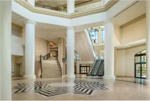 Convention Center Rotunda – A striking central hub showcasing escalators and staircases beneath soaring ceilings in the heart of the convention center.