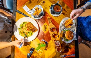 Ford’s Garage is known for its American comfort food and craft beer served up in what feels like a 1920’s service station and prohibition era bar with old style brick, dark colors and, of course, classic cars.