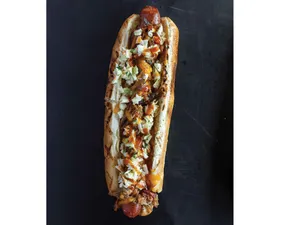 A chargrilled footlong hot dog topped with pulled pork, shredded cheddar, coleslaw, and 4R Signature Sauce. Available 7/1-7/28.