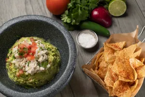 Blue crab, onion, tomato, jalapeño, cilantro, lime, avocado, Tajín tortilla chips