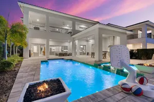 Twilight pool area at QJ948N at Reunion Resort