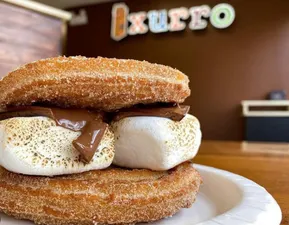 Do you like s'mores and churros? Now you can have them both. Our churro s'mores is made with two churro wheels rolled in cinnamon sugar, roasted marshmallow, and a Hershey chocolate.

After all, who doesn't love a good s'more?