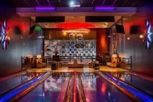 The Private King Pin Room features 4 private lanes, Giant Jenga, Connect-4, plus a private patio attached with a bocce ball/cornhole court 32 guests maximum capacity.
