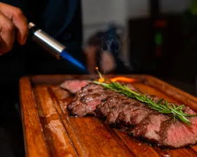 A hidden gem among the best cuts, our Flat Iron Steak brings bold flavor and tenderness to the table. Perfect for those seeking the ultimate Brazilian steakhouse experience, this specialty cut is served with the authentic fire-grilled tradition of churrasco brasileiro. For anyone searching for the best steakhouse near me, the journey ends here.