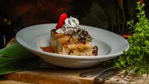 Shredded coconut, coconut milk, white chocolate chips, rum-poached raisins, buttery brioche, rum caramel & fresh homemade vanilla bean whipped cream