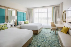 Escape to Gaylord Palms Resort's elevated guest rooms & suites, newly refreshed from a $102 million renovation. Soothing ocean-inspired hues and upgraded, modern furnishings create the perfect blend of comfort and sophistication. From rooms overlooking our airy, 4.5-acre garden atriums to spacious suites with deluxe amenities, we invite you to unwind and enjoy every moment of your enchanting stay.