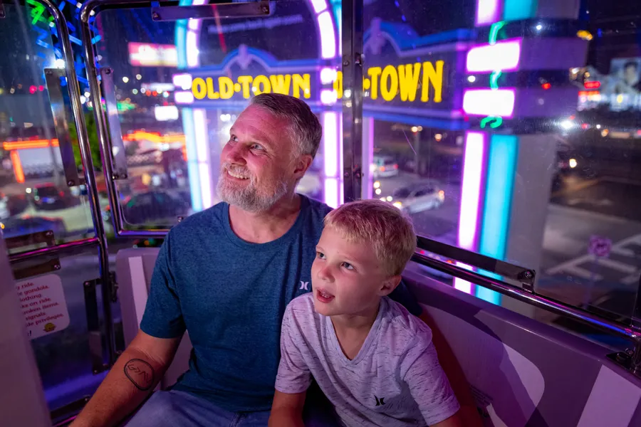 Dad and son enjoying the Ferris Wheel at Old Town.