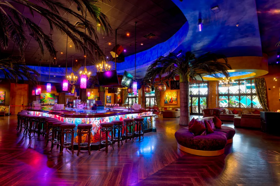 The Mojito bar is located on the second floor, surrounded by plenty of seating and couches.
