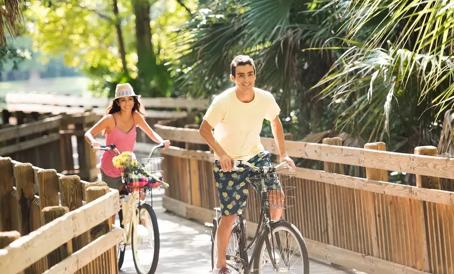 Man and Woman Riding Bikes on Trail