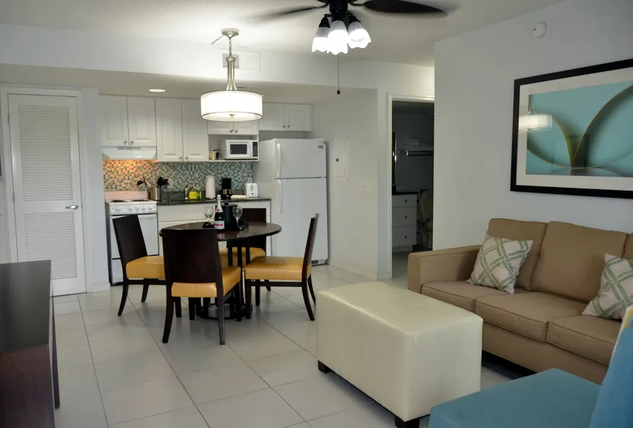 Living Room & Kitchenette with a full-size fridge and stove. Separate bedroom & bathroom.