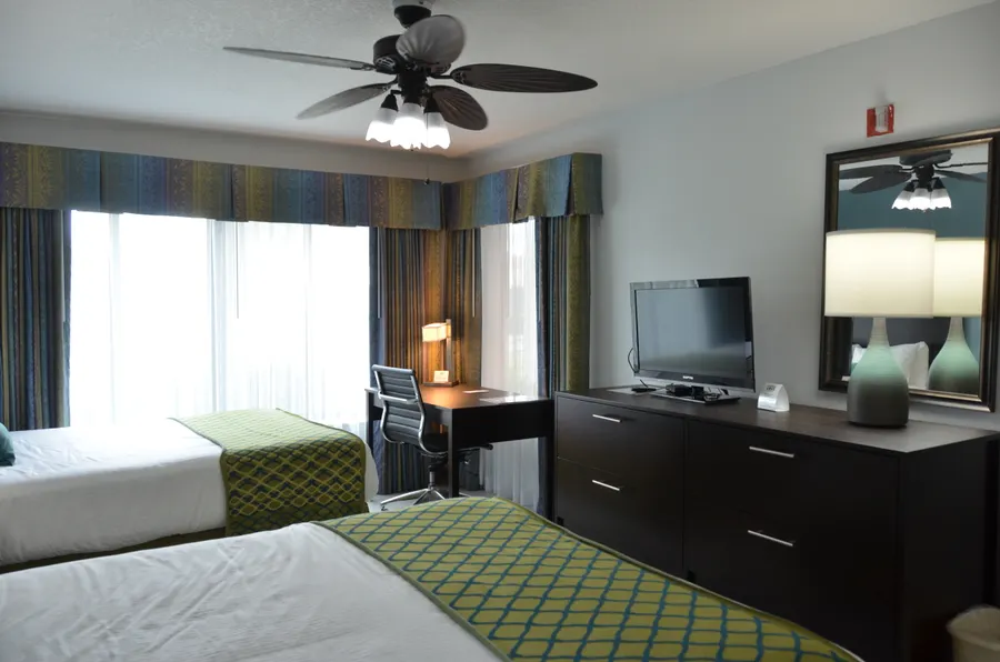 Living Room & Kitchenette with a full-size fridge and stove. Separate bedroom & bathroom.
