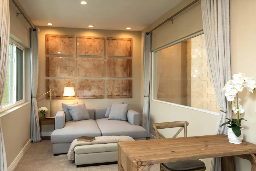 The master bedroom has a lounge area with a desk.