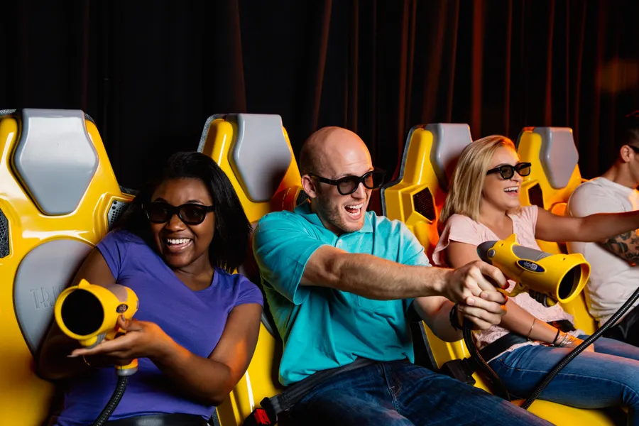 What is the Andretti 7D Xperience, you ask? It's the ride that everyone leaves talking about. The ride that engages your senses, immerses you in a world of action, and delivers an amazing 7D adventure that is unlike any other.
Andretti 7D Experience is a 3D interactive attraction with amazing special effects! Multiple riders at a time compete for the highest score using laser blasters and battling on-screen enemies. You actually feel the earth-rumbling movement and wind, hear the sounds all around you, and sometimes even jump with fright (or joy!).
The Andretti 7D Dark Ride experience is approximately 5 minutes in length. Riders must be at least 40″ tall.