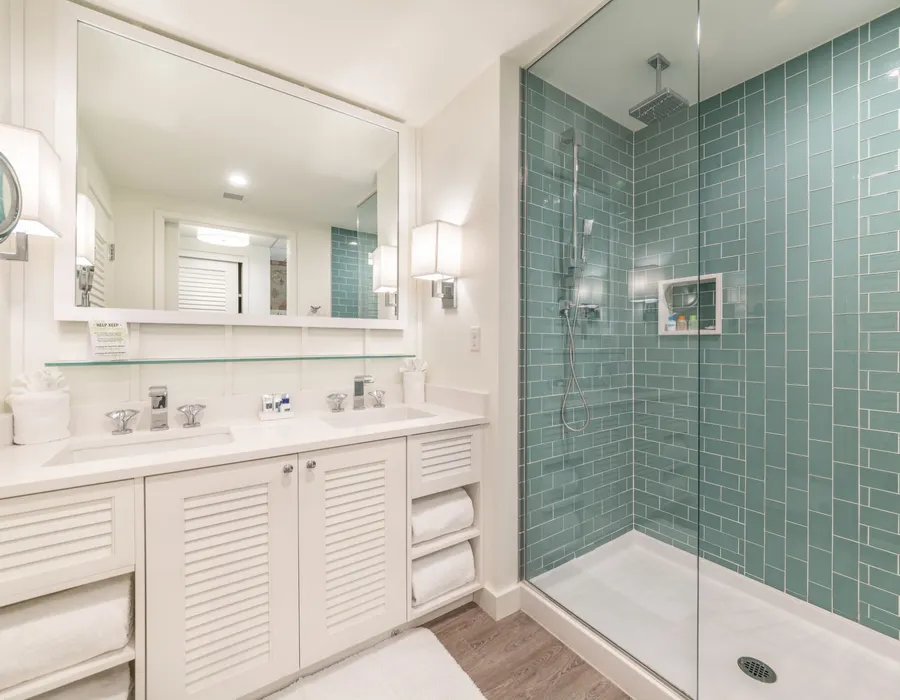 Sink and shower bathroom view from a suite.