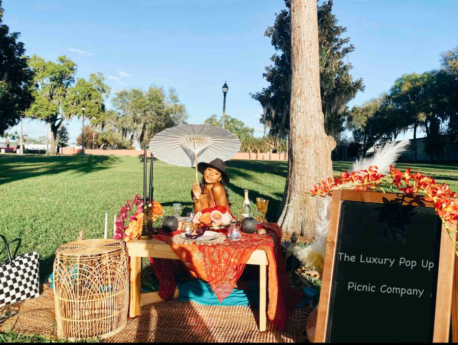 The Luxury Pop Up Picnic Company provides the ultimate picnic experience. Let us host your customized picnic - whether at the park, backyard, vacation rental, hotel, restaurant or indoors - it’s the chicest and most convenient way to celebrate someone special, a special occasion or team building event. We provide full event plans for your luxury picnic experience from design, set up and tear down. Each tailored pop up experience includes a pop up picnic table fully decorated with chargers, dinner plates, glassware, napkins, pillow seating, Bluetooth speaker, pop up picnic basket with comfy blankets, hand sanitizer, sunscreen, extra napkins,complimentary dessert and bottled water.