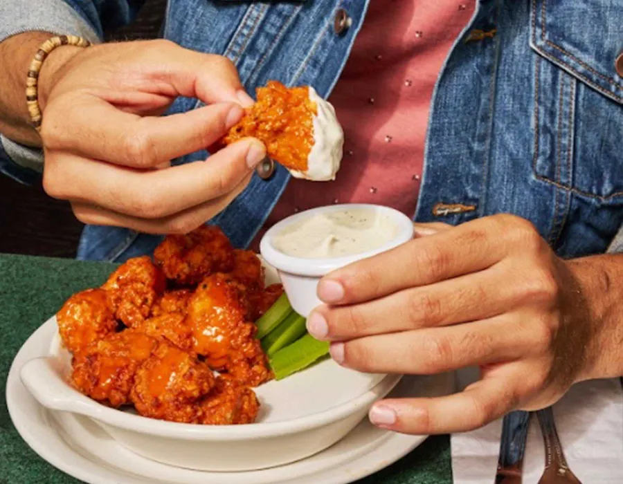 Boneless Wings - great shareable or meal! Crispy buttermilk marinated boneless wings, tossed in your choice of buffalo, spicy honey, or teriyaki spicy honey. Served with celery sticks and ranch or blue cheese.