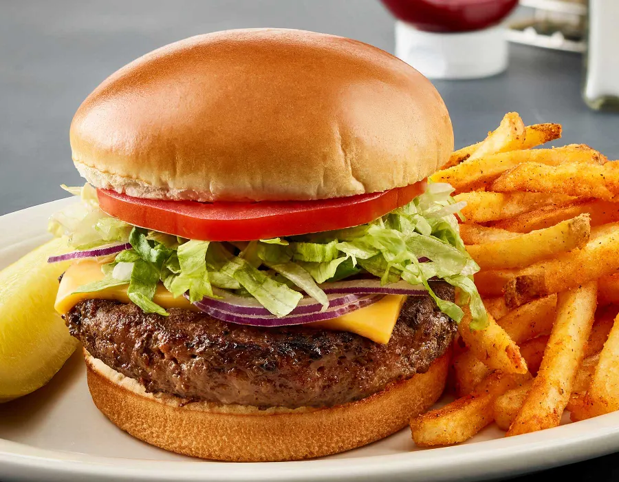 100% Angus burger, cheddar cheese, lettuce, tomato and red onions. Served with choice of side. Gluten-free bun available.