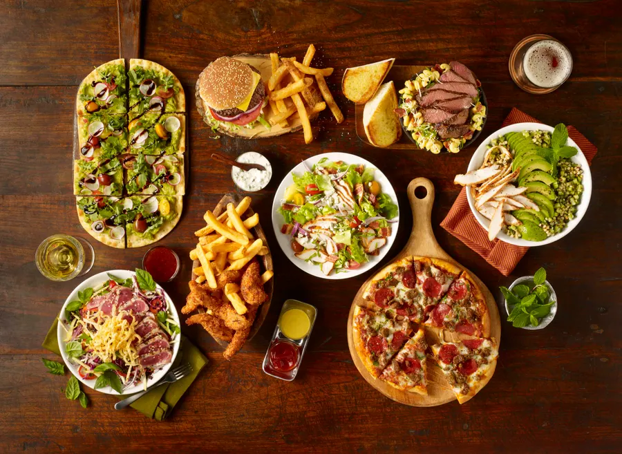 Whether you come early or stay late, Studio Movie Grill will set the mood to socialize and connect. Once inside, enjoy custom luxury recliners, laser projection and Q-SYS sound systems paired with an American Grill menu, full-service bar and in theater dining. Service buttons are placed at every seat, so your server instantly knows when you need to place an order or need assistance, and we’ll deliver your order directly to your seat anytime during the show.