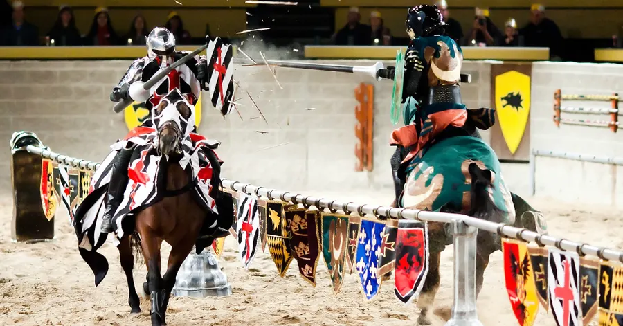 a joust between the black and white knight and the green knight