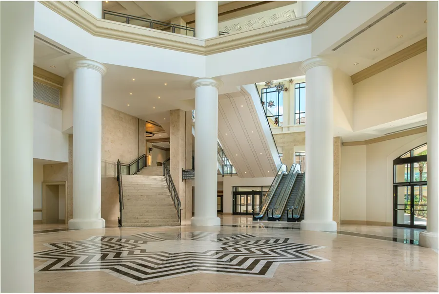Convention Center Rotunda – A striking central hub showcasing escalators and staircases beneath soaring ceilings in the heart of the convention center.