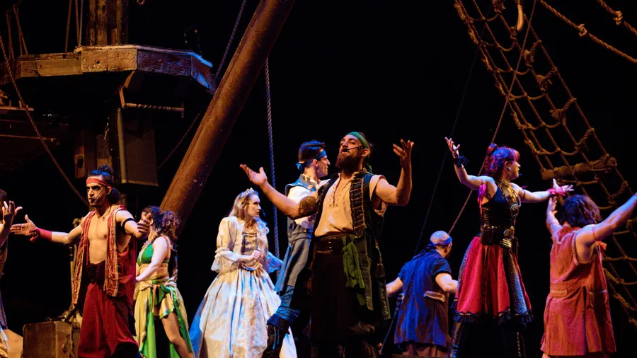 Pirates, Princess Anita, and Treasure, the captain's wife in the middle of the song, A Pirate's Life, during the show.