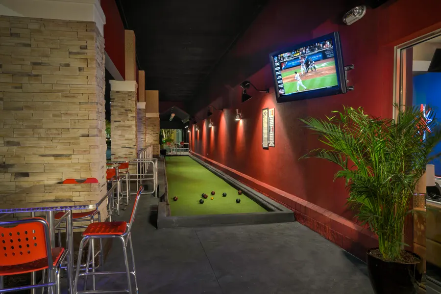 Kings Bocce Ball Patio is an extension to our Private King Pin Room which features 4 private lanes plus giant Jenga and Connect-4. The bocce ball court can also be used as a cornhole court.
