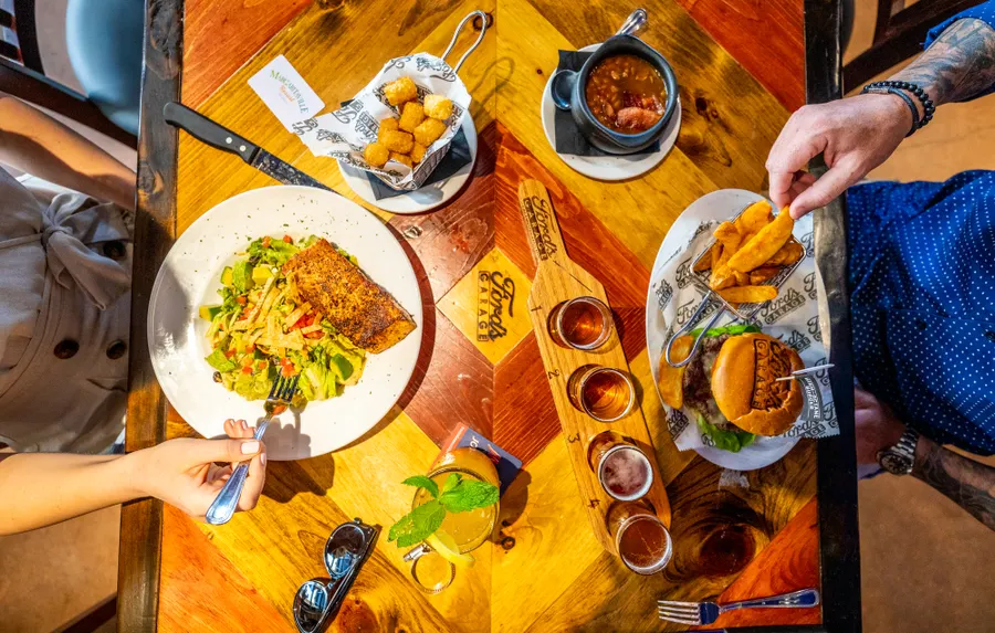Ford’s Garage is known for its American comfort food and craft beer served up in what feels like a 1920’s service station and prohibition era bar with old style brick, dark colors and, of course, classic cars.
