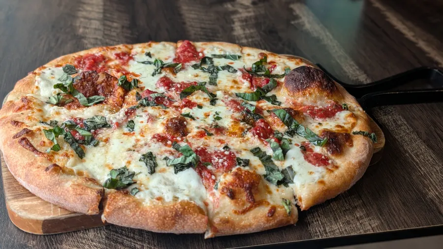 Fresh mozzarella, Plum Tomato sauce, Torn Basil and EVOO