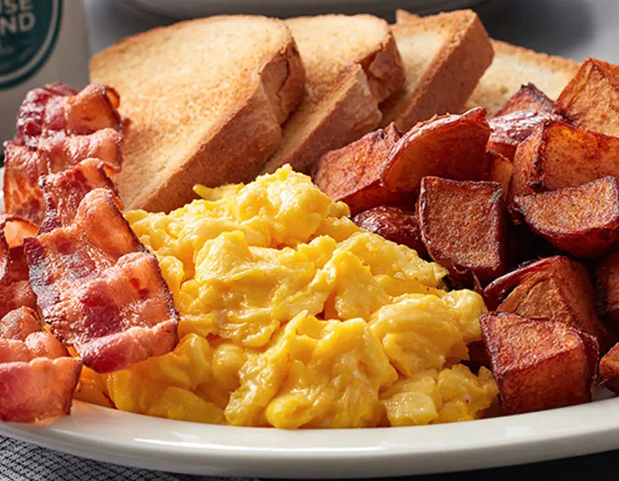 Eggs any style, hashbrowns, toast and choice of meat: bacon, sausage patties, sausage links, turkey sausage or Canadian bacon.