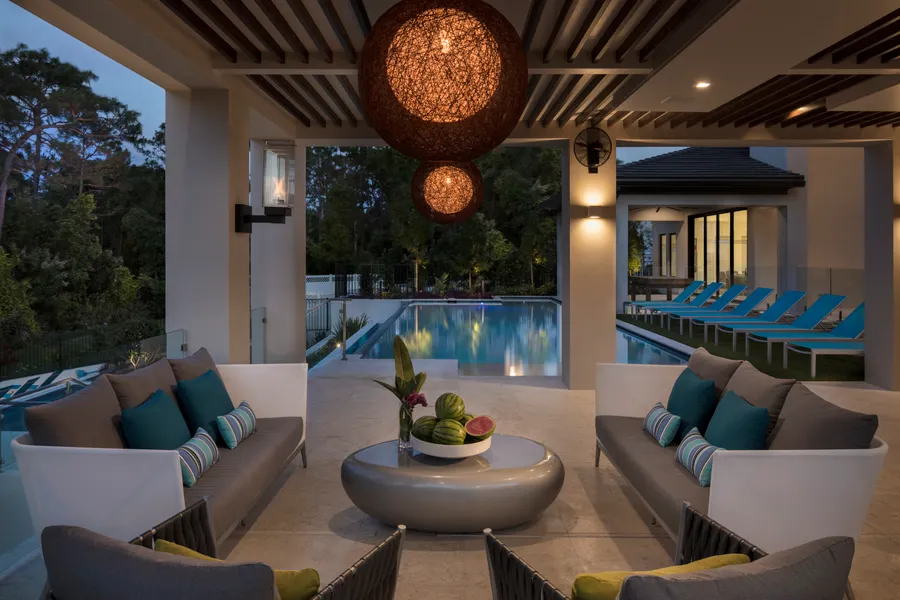Twilight patio lanai area showcasing beautiful outdoor seating with luxurious elements