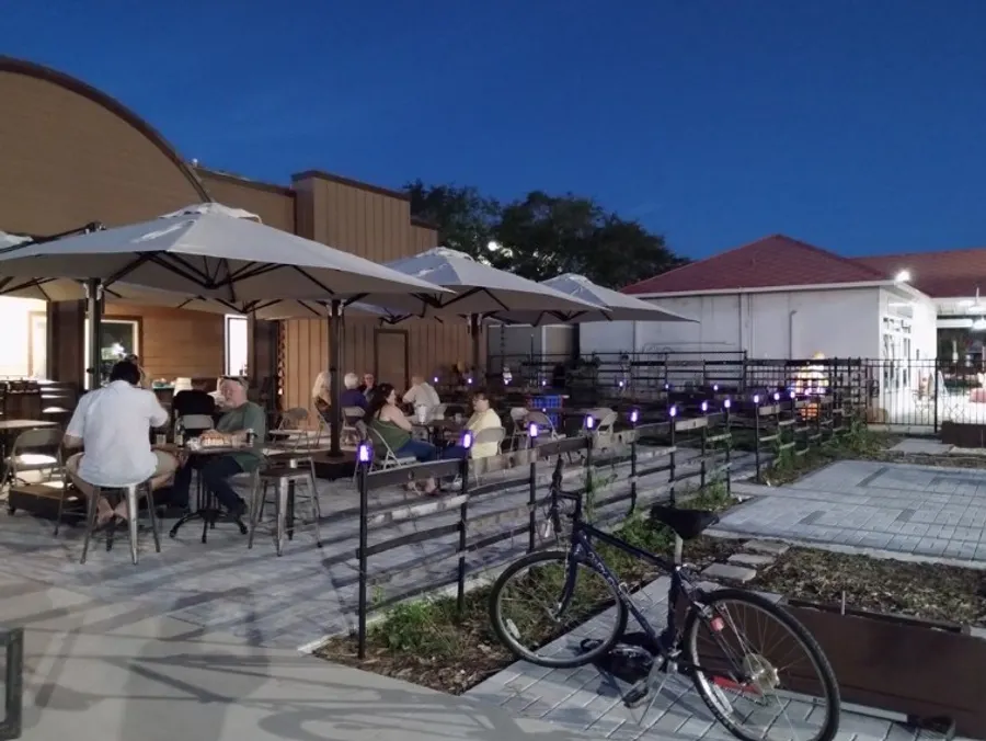 Our relaxing patio features seating with umbrellas to keep your guests cool and relaxed while enjoying the fresh air. Whether it's a casual gathering or a special celebration, this inviting space offers the perfect backdrop for memorable moments. (Capacity = 60 PPL )