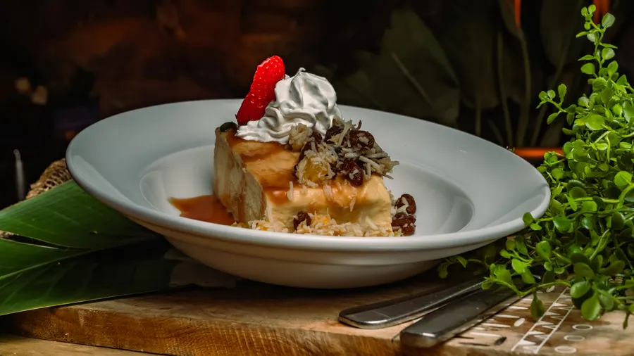Shredded coconut, coconut milk, white chocolate chips, rum-poached raisins, buttery brioche, rum caramel & fresh homemade vanilla bean whipped cream